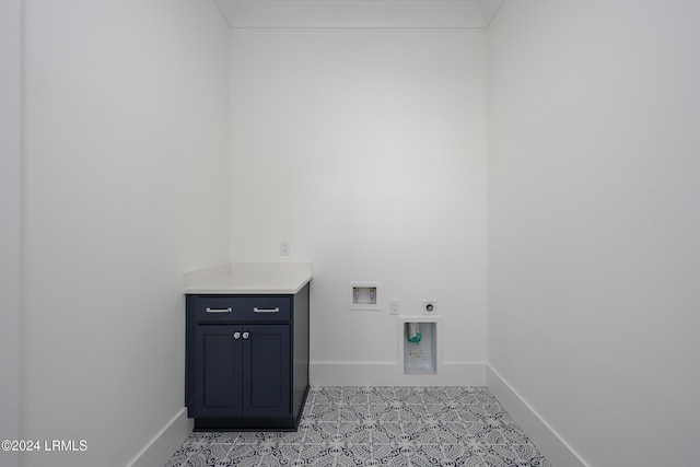 laundry area with cabinets, hookup for a washing machine, and hookup for an electric dryer