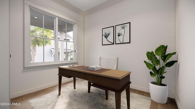 office area featuring light hardwood / wood-style floors and ornamental molding