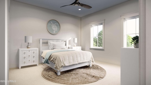 bedroom with ceiling fan and carpet