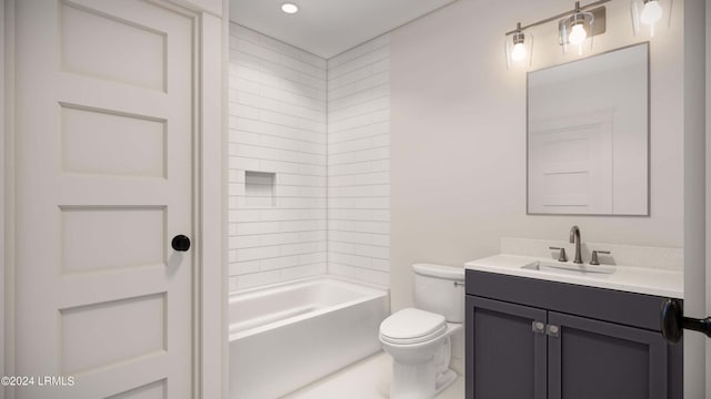 full bathroom featuring toilet, tiled shower / bath, and vanity