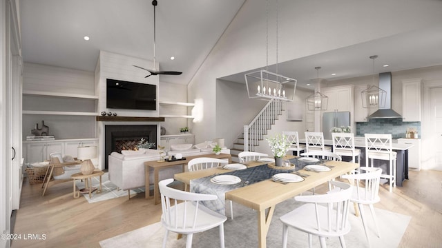 dining room featuring ceiling fan, high vaulted ceiling, and light hardwood / wood-style floors