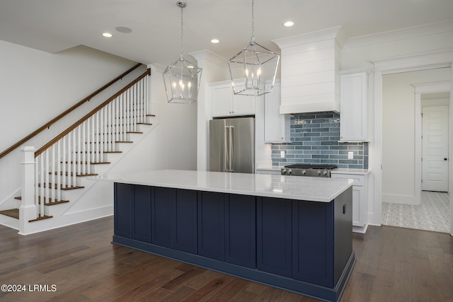 kitchen featuring decorative light fixtures, a spacious island, white cabinetry, and high end fridge