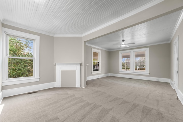 unfurnished living room with ornamental molding, light carpet, and ceiling fan