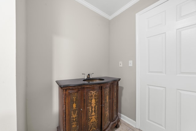 bathroom featuring sink, crown molding, and tile patterned floors