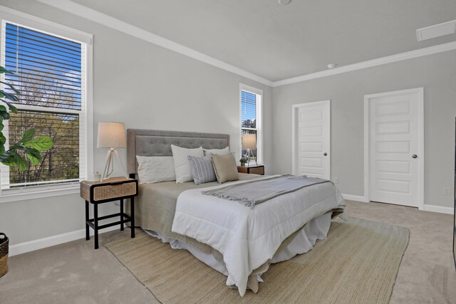 carpeted bedroom featuring crown molding