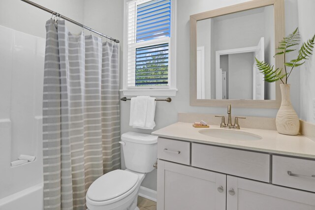 bathroom with toilet and vanity