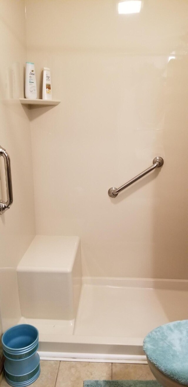 107 Kelly St, Walterboro, SC 29488 - bathroom featuring walk in shower and tile patterned flooring