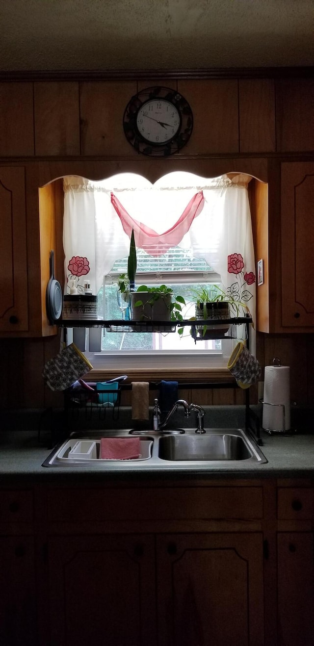 107 Kelly St, Walterboro, SC 29488 - kitchen with brown cabinets and a sink