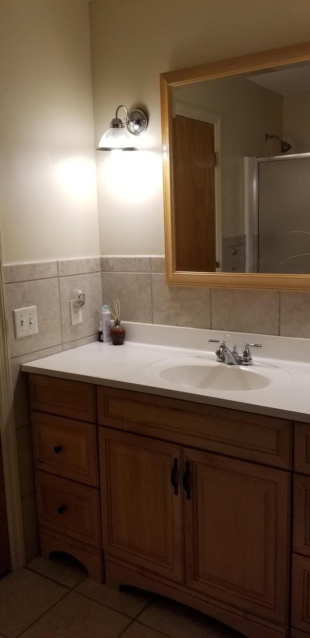107 Kelly St, Walterboro, SC 29488 - bathroom with walk in shower, tile walls, and vanity