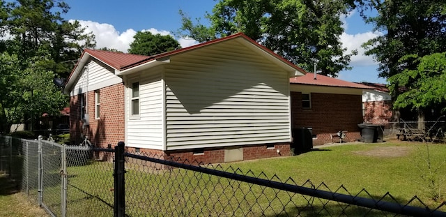 107 Kelly St, Walterboro, SC 29488 - view of side of home featuring a yard, metal roof, crawl space, a fenced backyard, and a gate