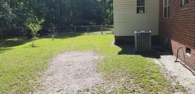 107 Kelly St, Walterboro, SC 29488 - view of yard featuring central air condition unit and a fenced backyard