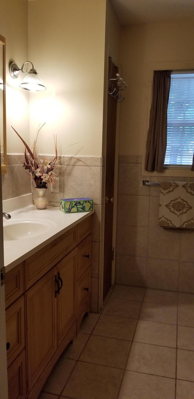 107 Kelly St, Walterboro, SC 29488 - bathroom with wainscoting, vanity, tile walls, and tile patterned floors