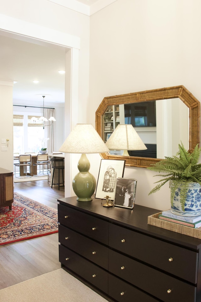 1723 Bolden Dr, Mount Pleasant, SC 29466 - detailed view of wood finished floors, a chandelier, and ornamental molding