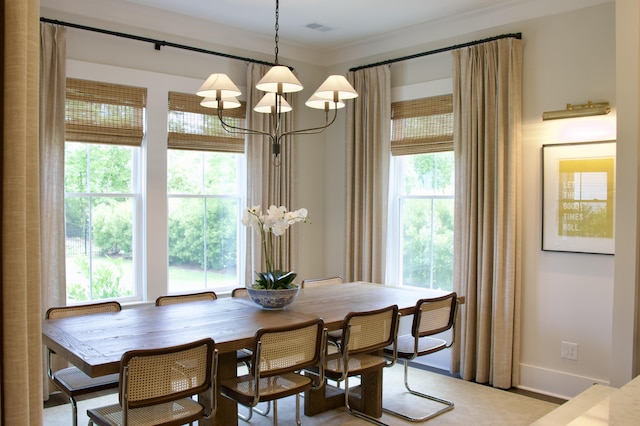 1723 Bolden Dr, Mount Pleasant, SC 29466 - dining space with a chandelier, baseboards, and crown molding