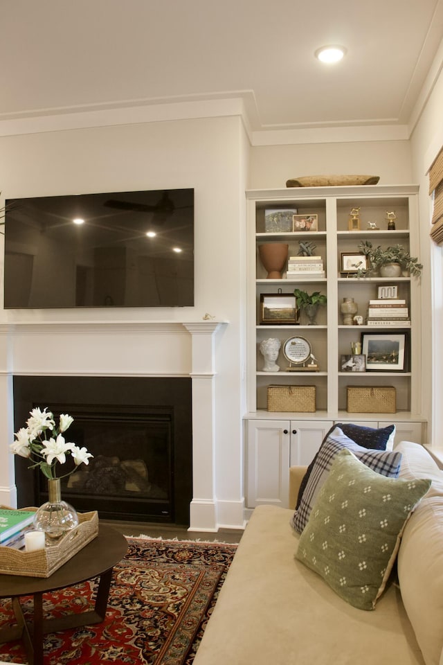 1723 Bolden Dr, Mount Pleasant, SC 29466 - living area featuring ornamental molding, a fireplace, baseboards, and built in features