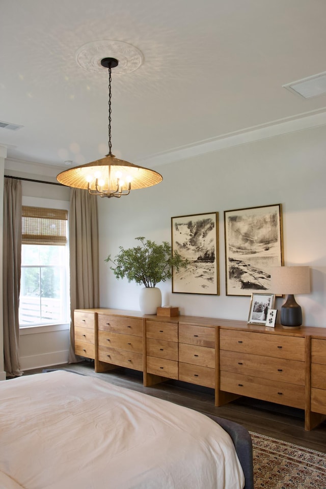 1723 Bolden Dr, Mount Pleasant, SC 29466 - bedroom with dark wood-style flooring, ornamental molding, and a chandelier