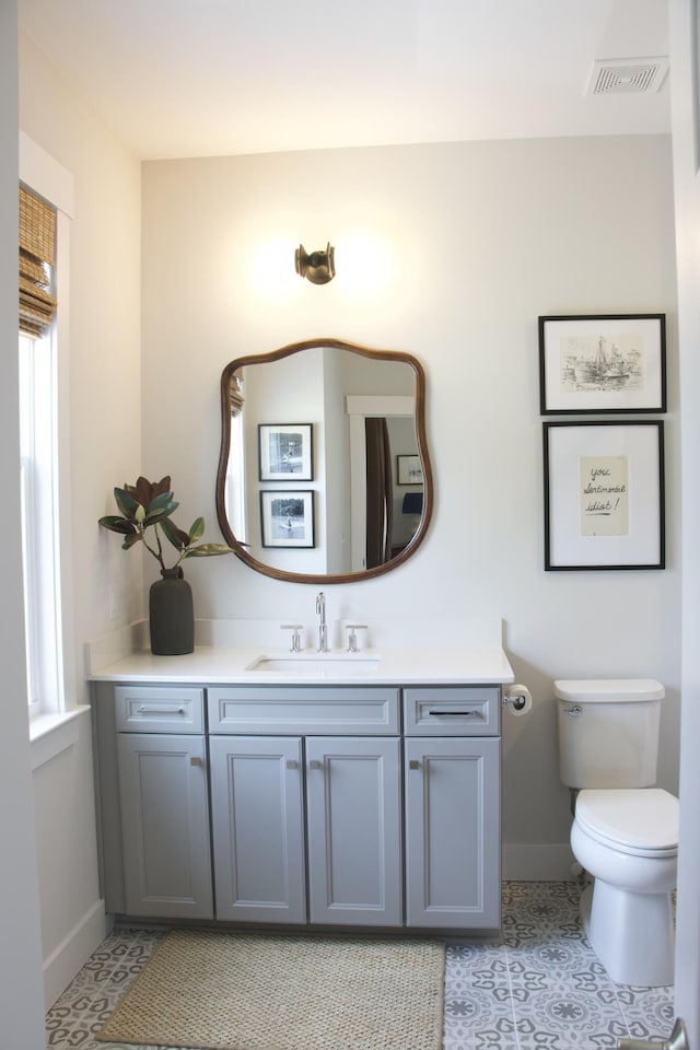 1723 Bolden Dr, Mount Pleasant, SC 29466 - bathroom featuring baseboards, vanity, toilet, and tile patterned flooring
