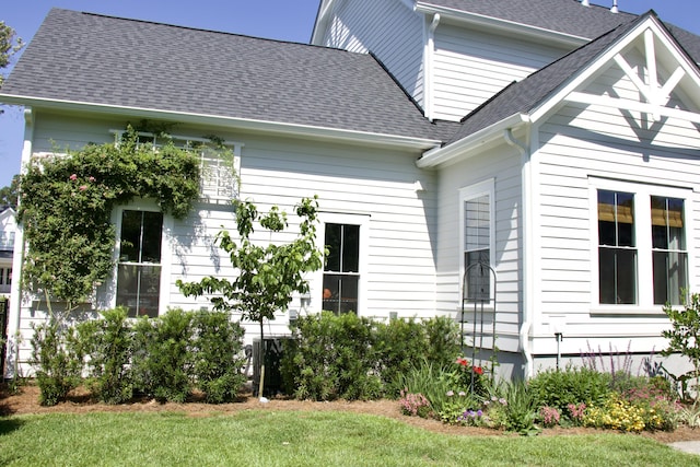 1723 Bolden Dr, Mount Pleasant, SC 29466 - rear view of property featuring a shingled roof and a lawn