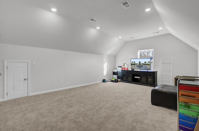 interior space featuring visible vents, carpet floors, and lofted ceiling