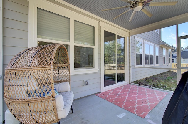 sunroom / solarium with ceiling fan