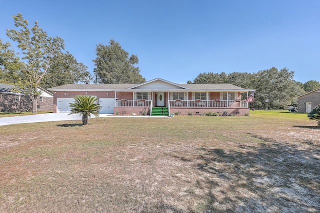 view of front of property with a garage, a front lawn, and covered porch