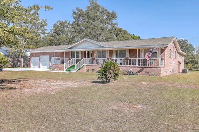 single story home featuring cooling unit, a front lawn, a porch, and a garage