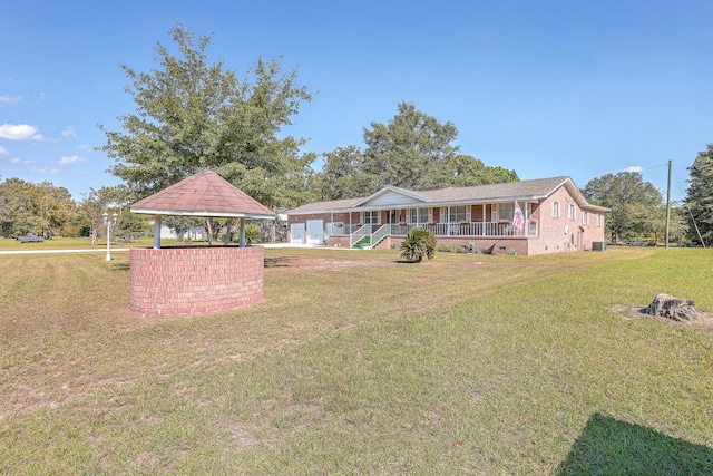 exterior space featuring a gazebo and covered porch