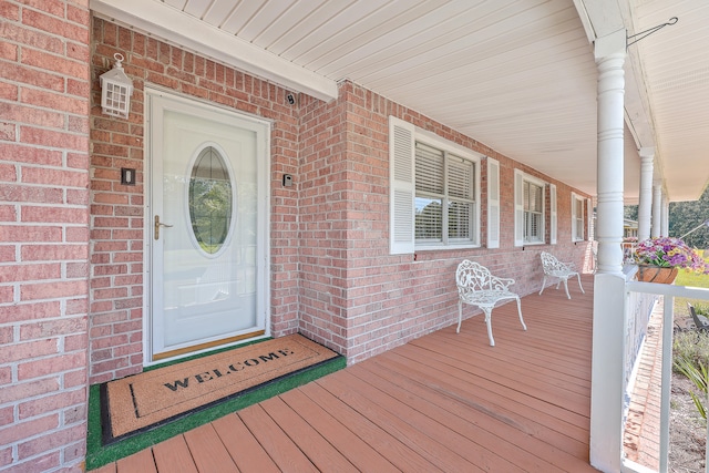 doorway to property with covered porch