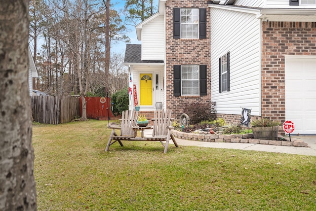 exterior space with a garage and a yard