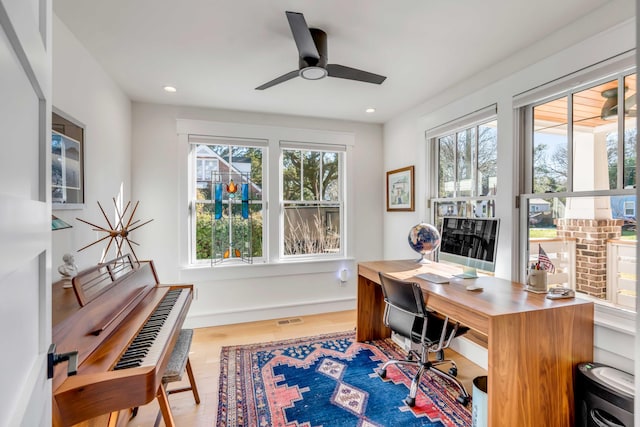 office space with recessed lighting, visible vents, plenty of natural light, and wood finished floors