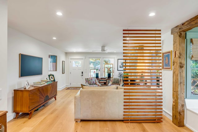 living area with recessed lighting, baseboards, hardwood / wood-style floors, and a ceiling fan