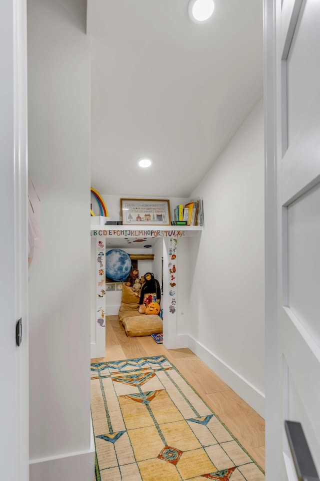 interior space with recessed lighting, light wood-style floors, and baseboards