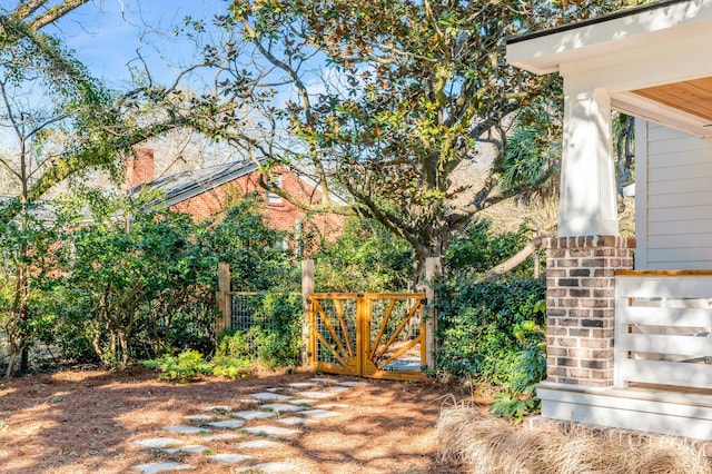 view of gate with fence