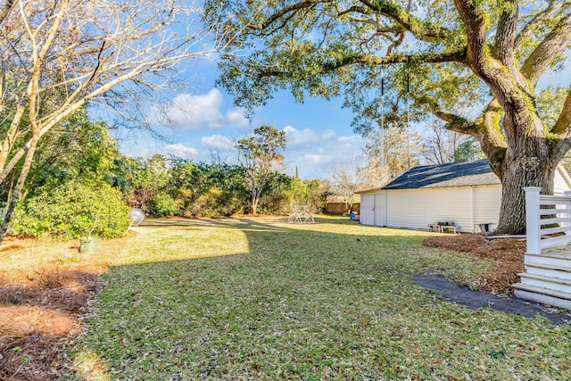 view of yard with a storage shed and an outdoor structure