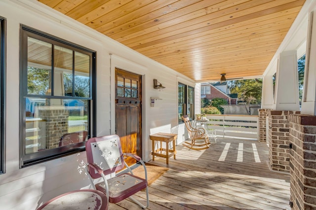 wooden terrace with a porch