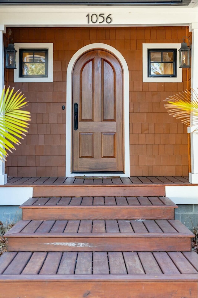 doorway to property featuring a standing seam roof