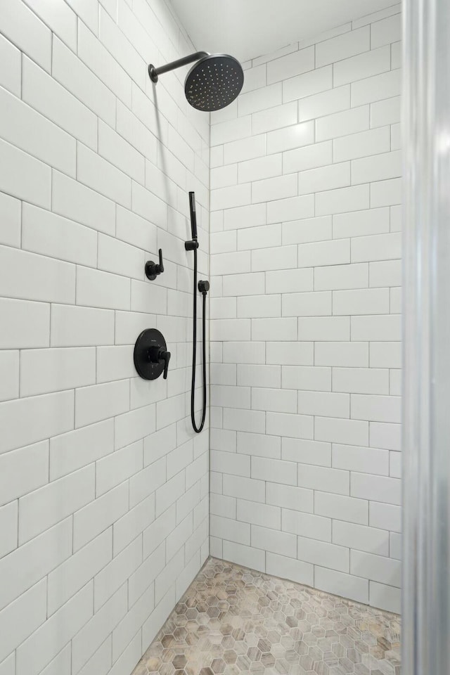 bathroom with tiled shower