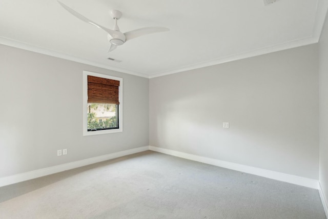 carpeted empty room featuring baseboards, visible vents, and ornamental molding