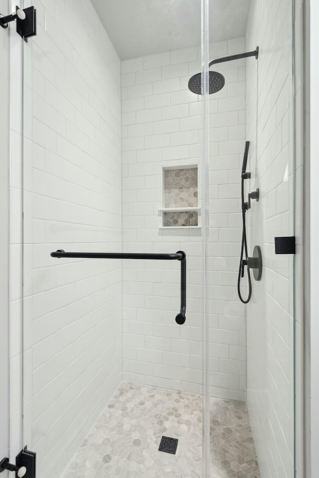 full bathroom with a shower stall