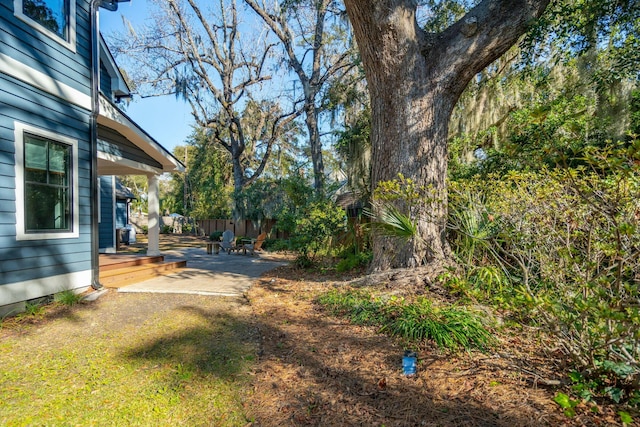 view of yard with fence and a wooden deck