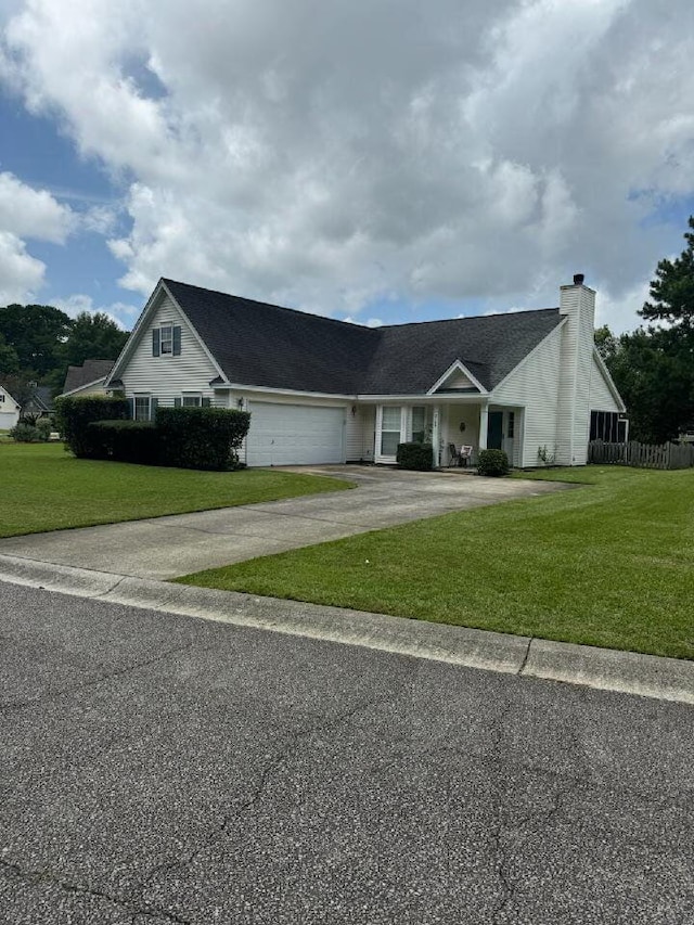 2709 Palmetto Hall Blvd, Mount Pleasant, SC 29466 - view of front of house with a chimney, asphalt driveway, and a garage