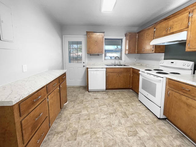 kitchen with sink and white appliances