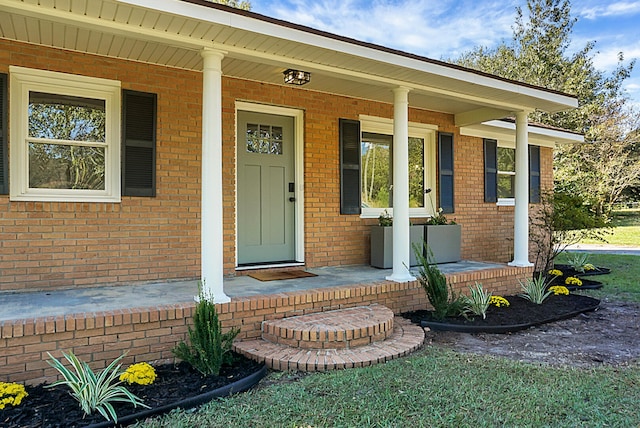 doorway to property with a porch