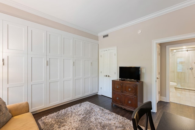 sitting room featuring ornamental molding, visible vents, and dark wood-style floors