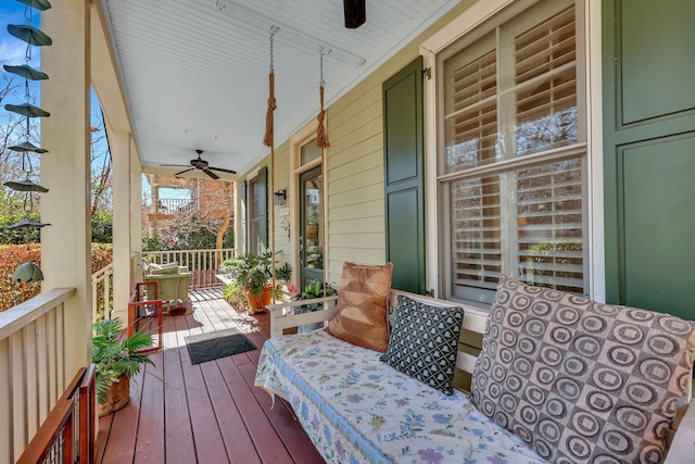 deck featuring ceiling fan and a porch