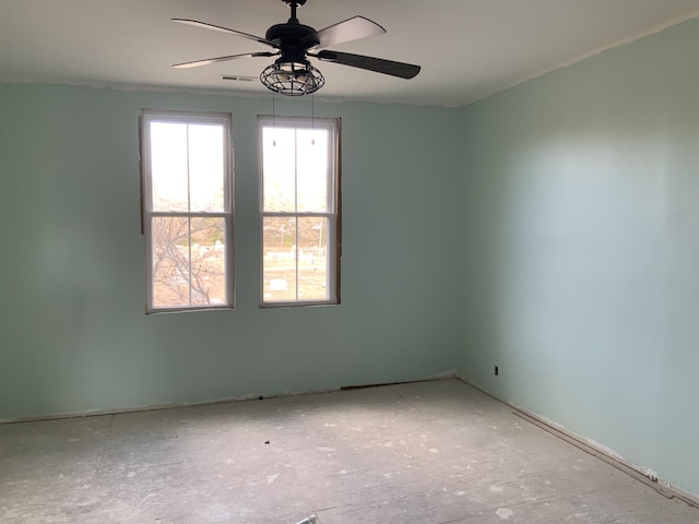 spare room with ceiling fan