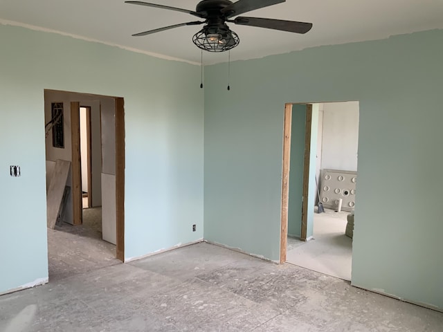 unfurnished room with ceiling fan