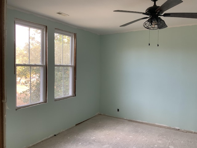 unfurnished room with ceiling fan