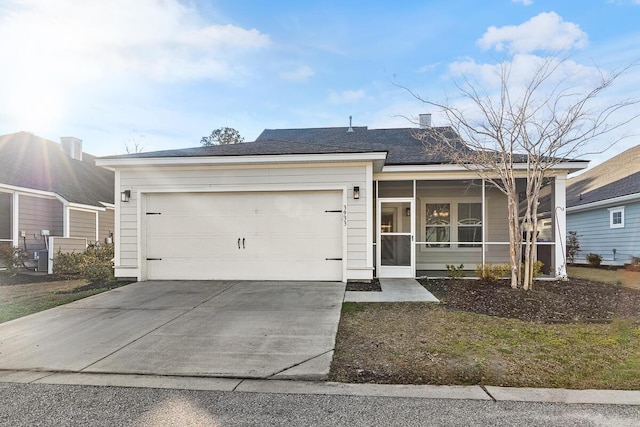 single story home featuring driveway, an attached garage, and a sunroom