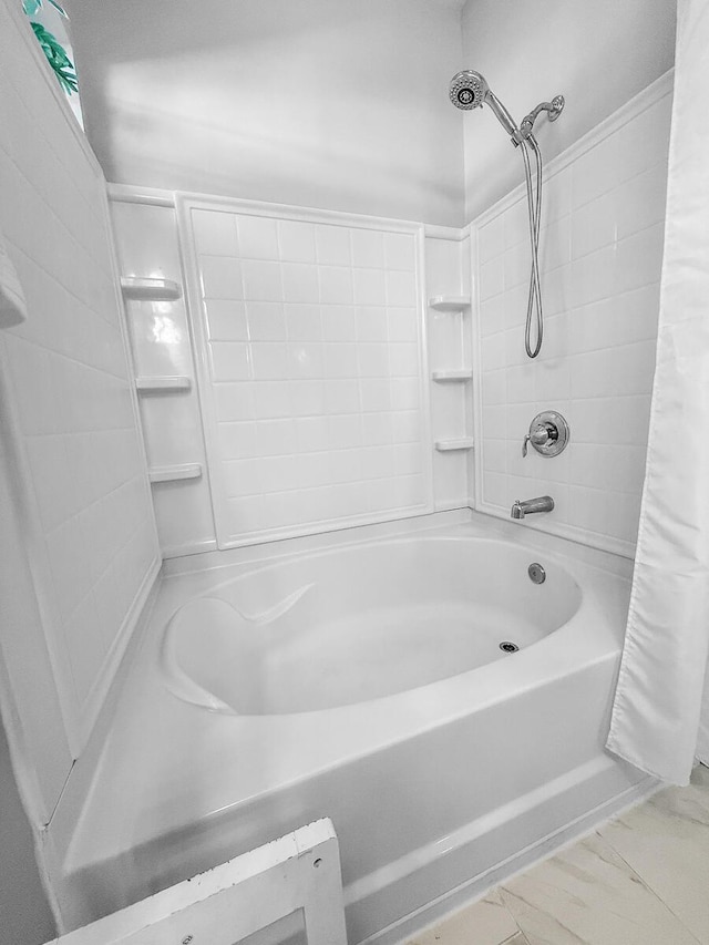 full bath featuring shower / bath combo with shower curtain